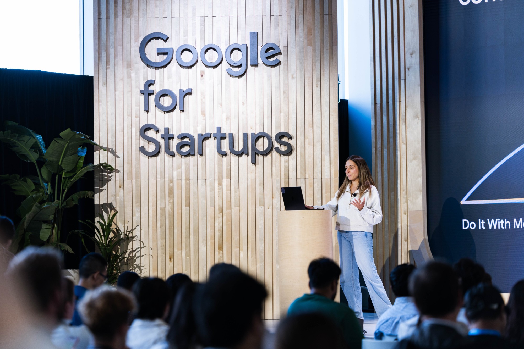 Jaclyn Konzelmann presenting on stage at a Google for Startups event